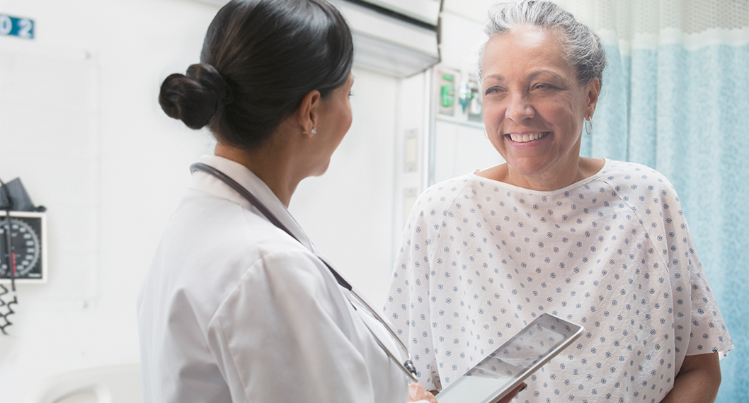 Female doctor providing care to older woman through Medicare Part A