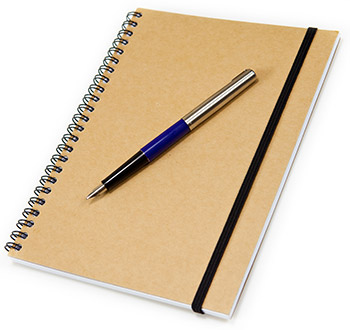 Notebook with a pen on it