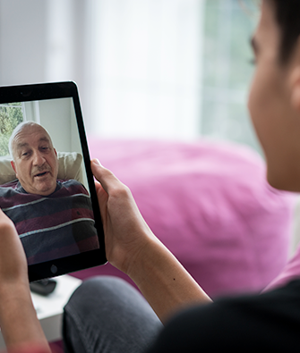 man video chatting with his father